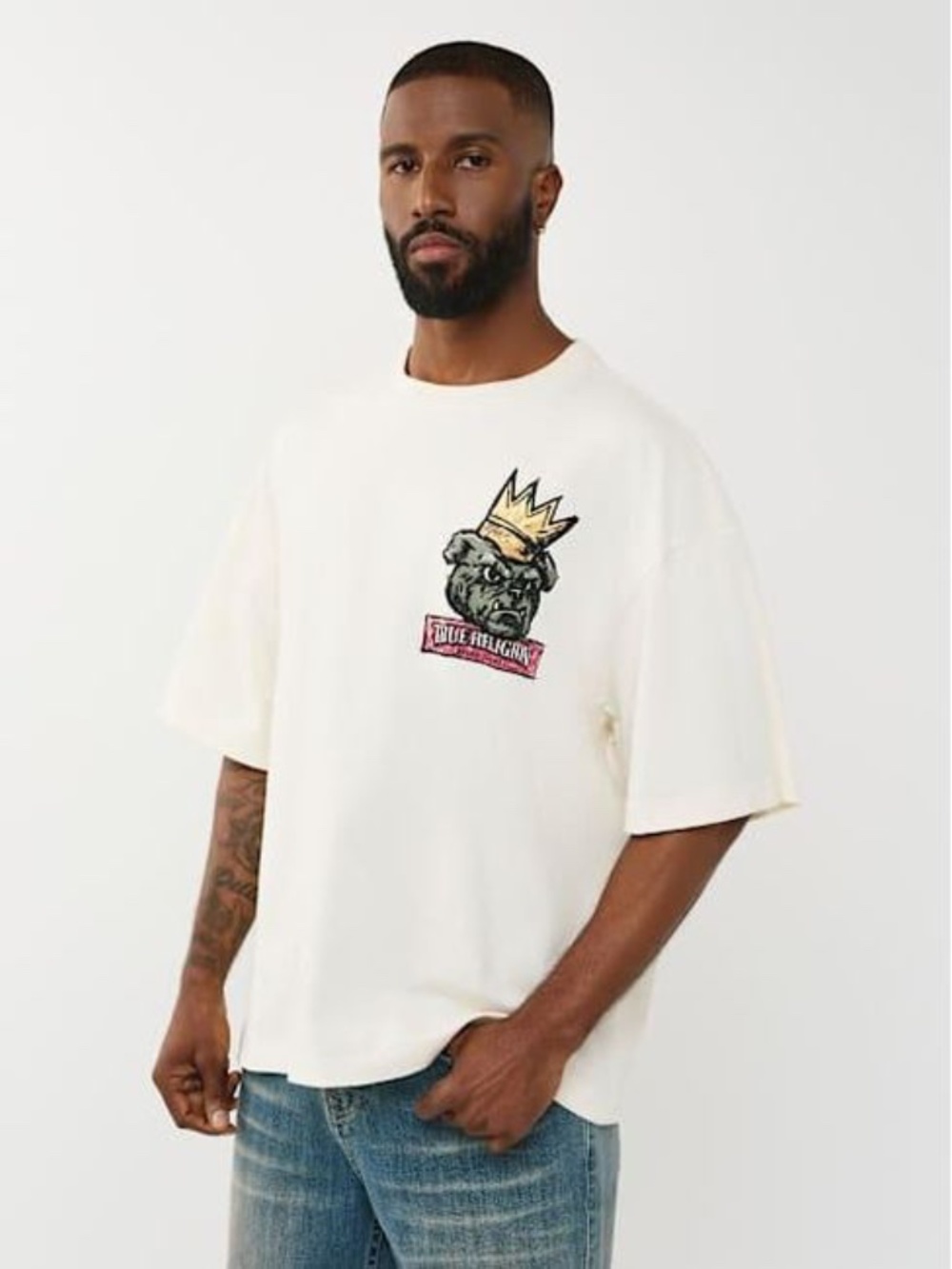 True Religion Cream Short Sleeve Tee with Crowned Dog Graphic and Brand Banner